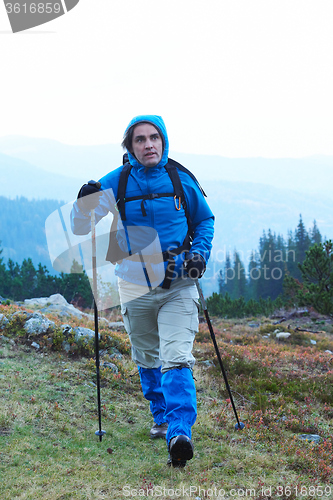 Image of advanture man with backpack hiking