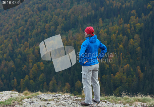 Image of advanture man with backpack hiking