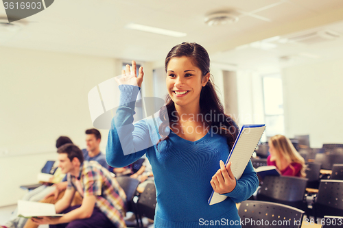 Image of group of smiling students in lecture hall