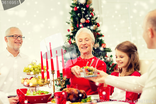 Image of smiling family having holiday dinner at home