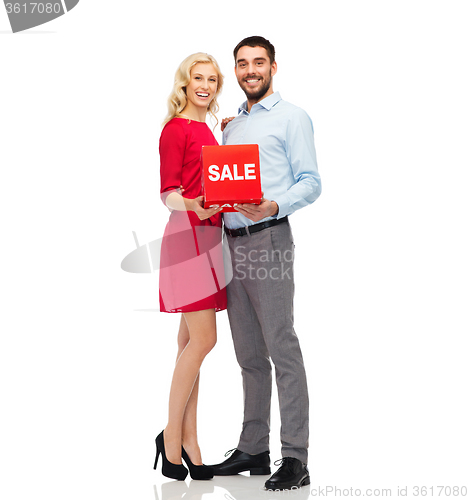 Image of happy couple with red sale sign