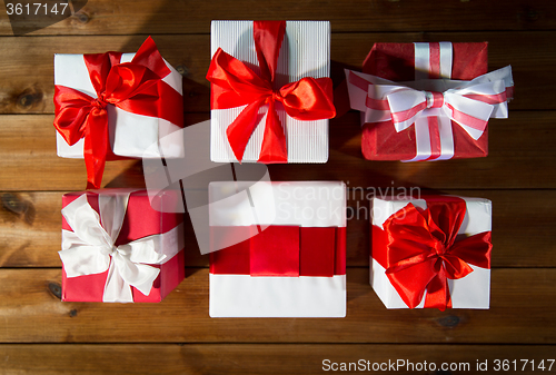 Image of close up of gift boxes on wooden floor from top