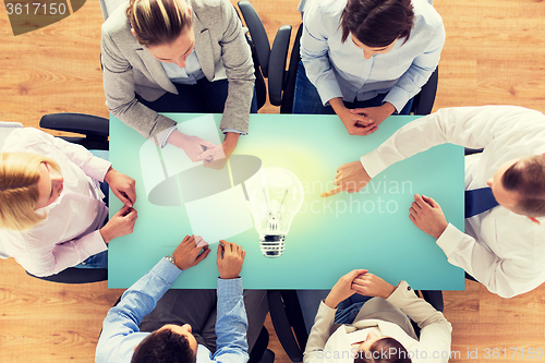 Image of close up of business team sitting at table