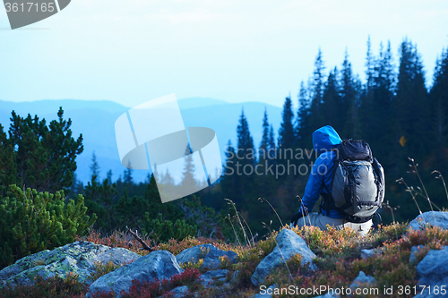 Image of advanture man with backpack hiking