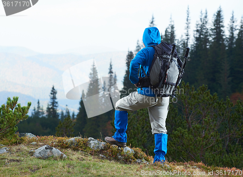 Image of advanture man with backpack hiking