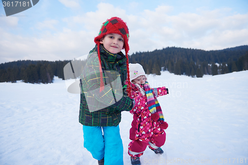 Image of kids walking on snow