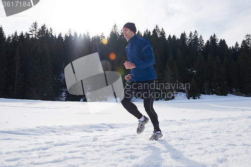 Image of jogging on snow in forest