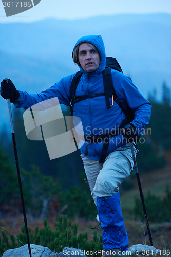 Image of advanture man with backpack hiking