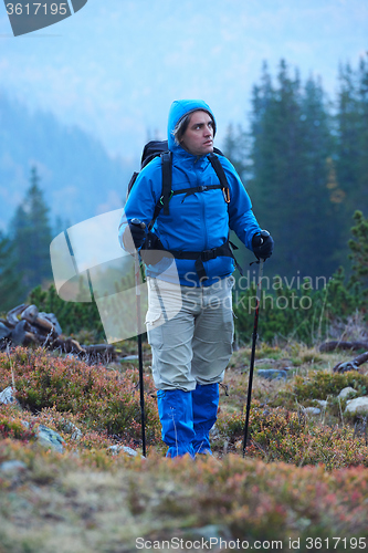 Image of advanture man with backpack hiking