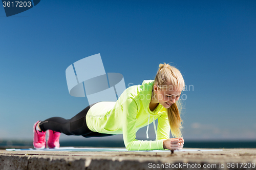 Image of woman doing sports outdoors