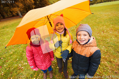 Image of group of happy children in autumn park