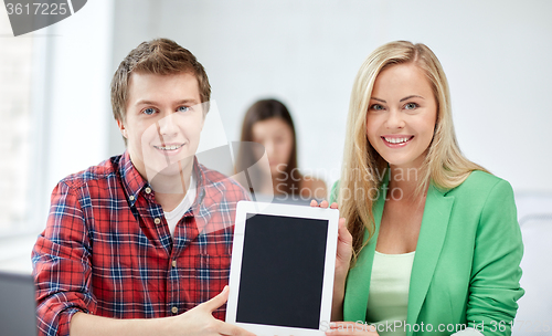 Image of group of happy high school students with tablet pc