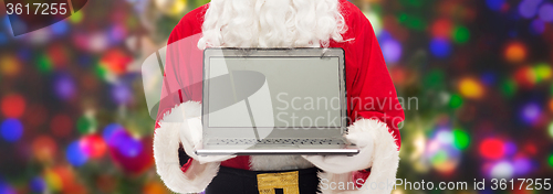 Image of close up of santa claus with laptop