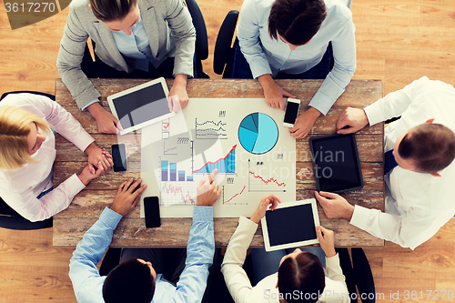 Image of business team with smartphones and tablet pc