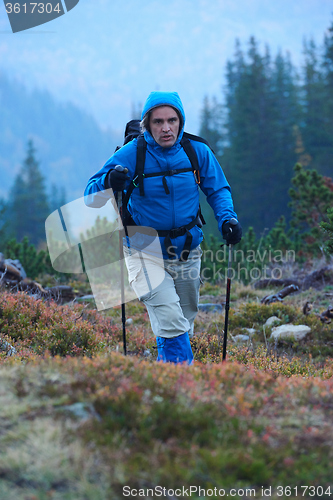 Image of advanture man with backpack hiking