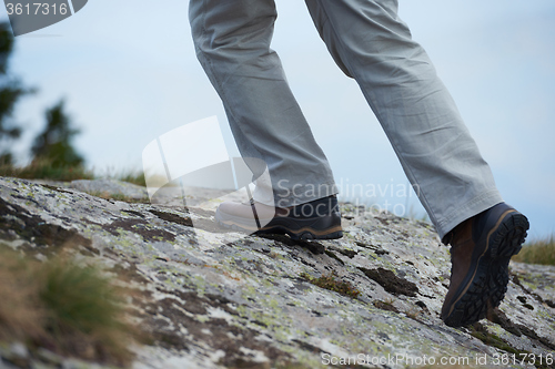 Image of hiking man with trekking boots