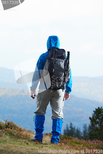 Image of advanture man with backpack hiking