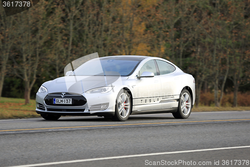 Image of Silver Tesla Electric Car On the Road