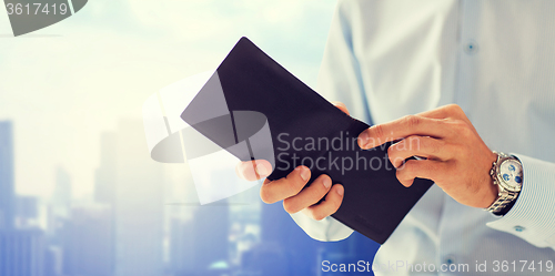 Image of close up of businessman hands holding open wallet