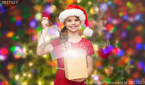 Image of smiling girl in santa helper hat with gift box