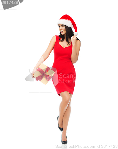 Image of beautiful sexy woman in santa hat with gift box