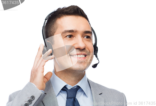 Image of smiling businessman in headset