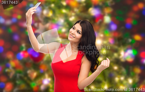 Image of sexy woman taking selfie picture by smartphone