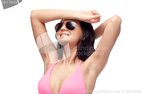 Image of happy woman in sunglasses and swimsuit