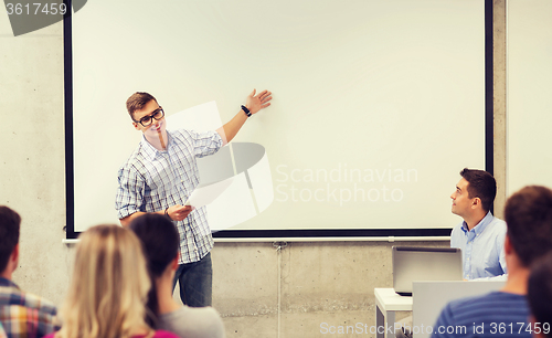 Image of group of students and teacher in classroom