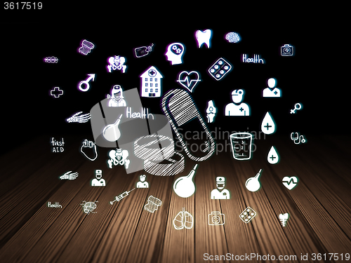 Image of Medicine concept: Pills in grunge dark room