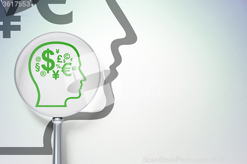 Image of Advertising concept:  Head With Finance Symbol with optical glass on digital background