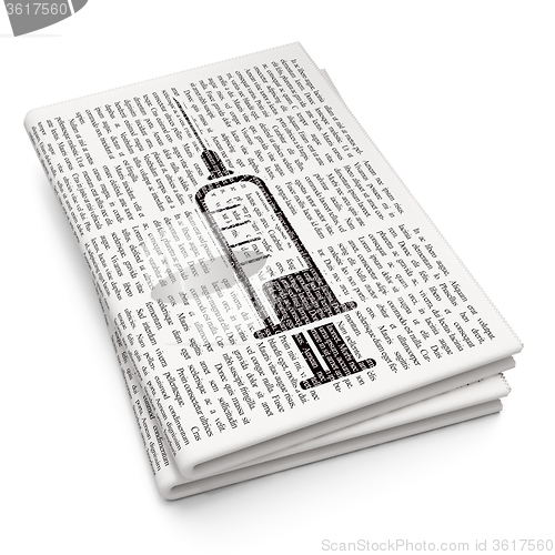 Image of Medicine concept: Syringe on Newspaper background