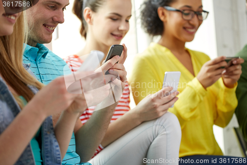 Image of close up of students with smartphones at school