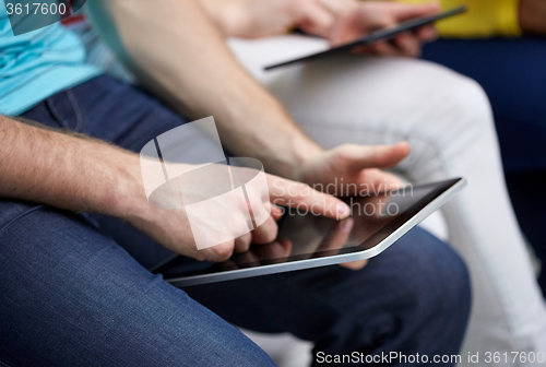 Image of close up of student hands with tablet pc at school
