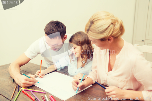 Image of happy family drawing at home