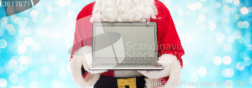 Image of close up of santa claus with laptop