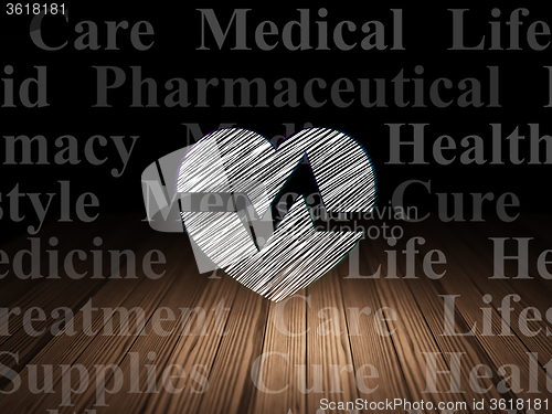 Image of Health concept: Heart in grunge dark room