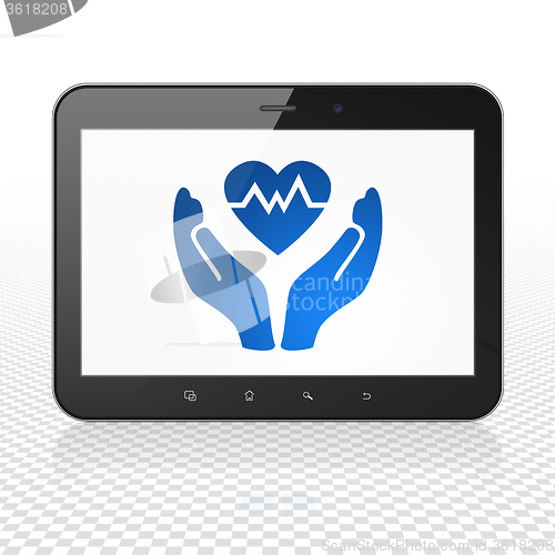 Image of Insurance concept: Tablet Computer with Heart And Palm on display