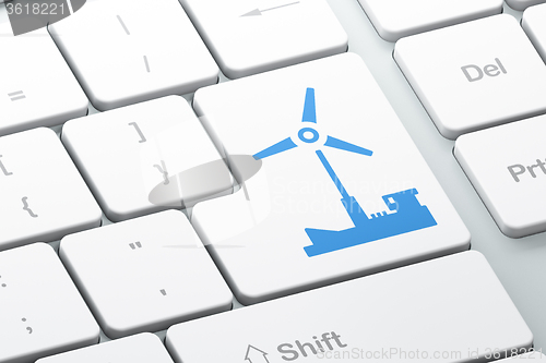 Image of Manufacuring concept: Windmill on computer keyboard background