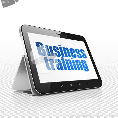 Image of Learning concept: Tablet Computer with Business Training on display