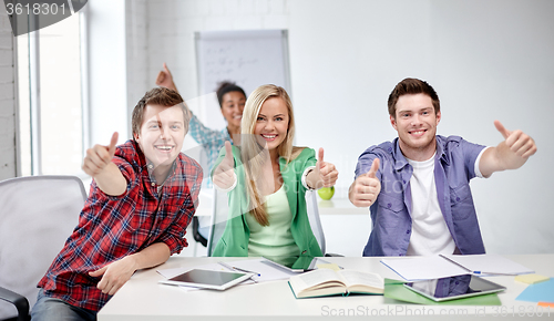 Image of group of happy students showing thumbs up