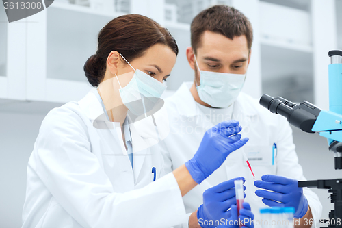 Image of young scientists making test or research in lab