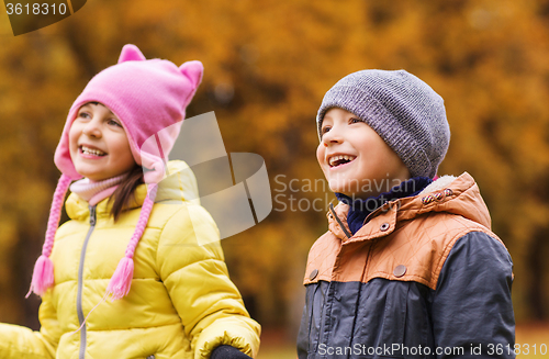 Image of group of happy children in autumn park