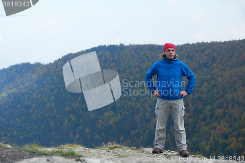 Image of advanture man with backpack hiking