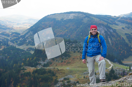 Image of advanture man with backpack hiking