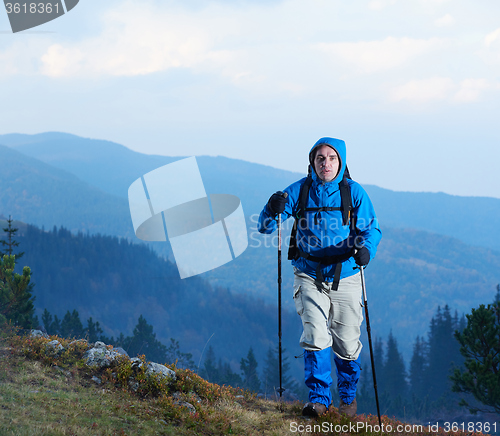 Image of advanture man with backpack hiking