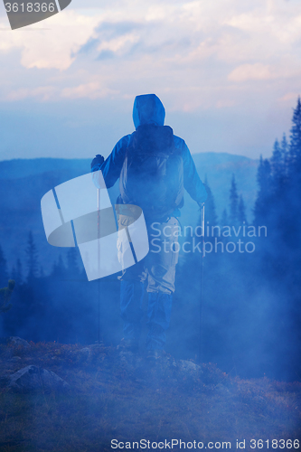 Image of advanture man with backpack hiking