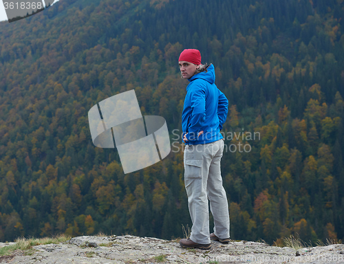 Image of advanture man with backpack hiking