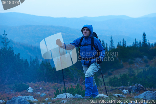 Image of advanture man with backpack hiking