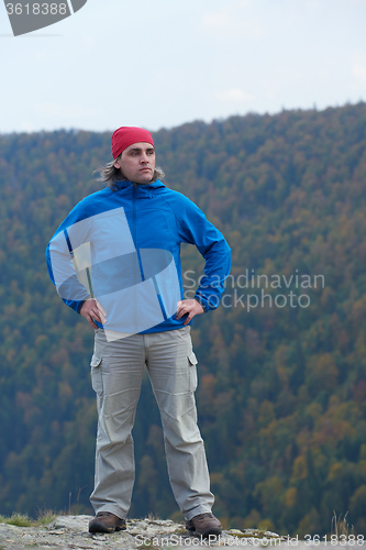 Image of advanture man with backpack hiking